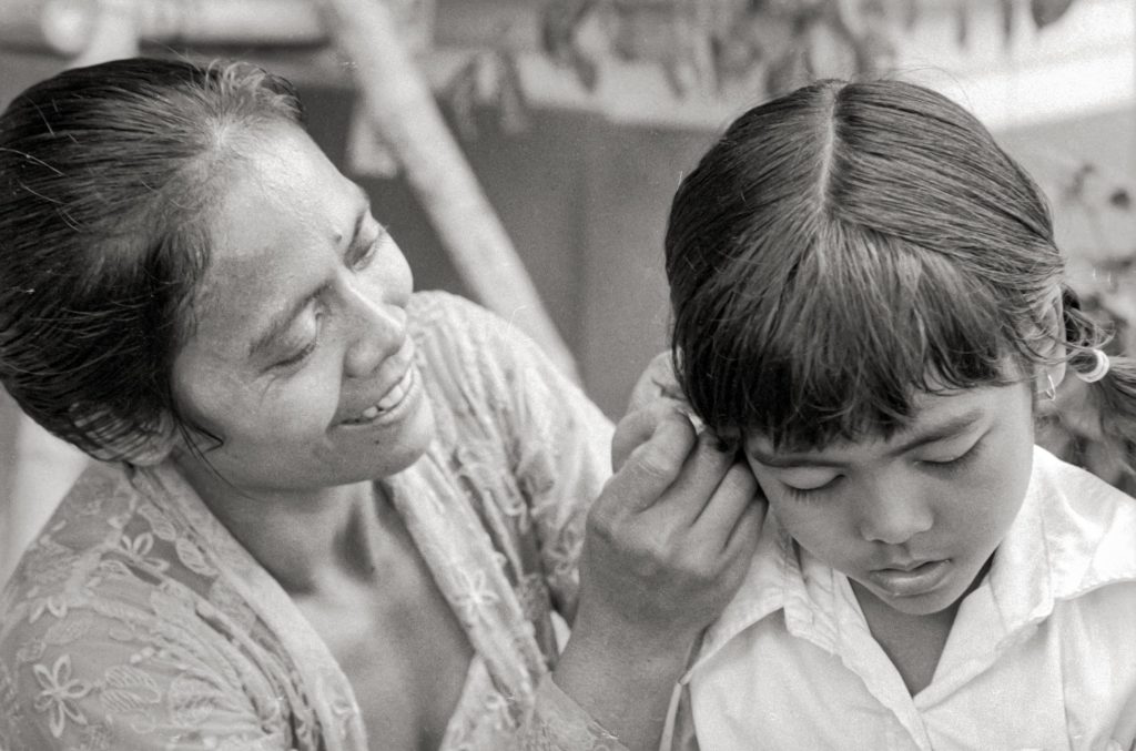 Oka Wati with her Daughter