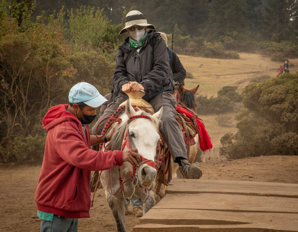 Joanne getting dismounting from her horse.